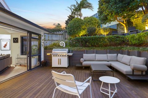 The back garden has been landscaped into two levels with a bbq and lounge area and a sun trap further up the hill.