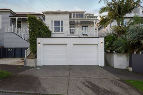 The original villa frontage with garage parking for two cars.