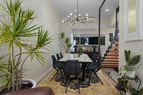 The formal dining space divides the main lounge area and the relaxed cosy nook lounge.