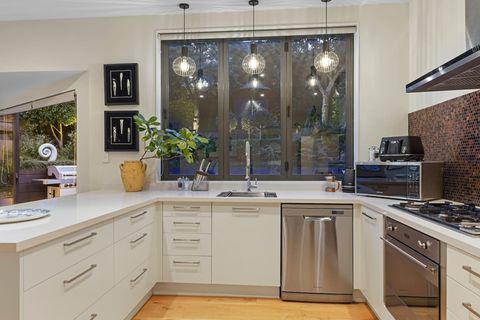 The modern kitchen is light with stainless steel appliances, so you can create a culinary masterpiece.