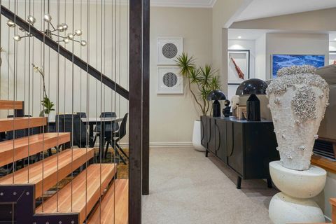 The newly instated stair case is a piece of sculpture in its own right with the dramatic black steel and warm wooden trends.