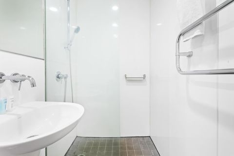 Enjoy your shower in this open-concept bathroom.