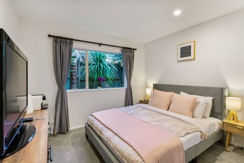 Queen bed in tones of pink offers a great place to rest and relax.