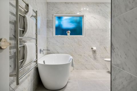 Relax in the soaking tub with a glass of wine and magazine.