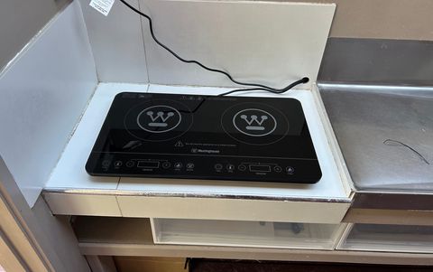 There is a portable cooktop available for you to use in an undercover outside kitchenette area.