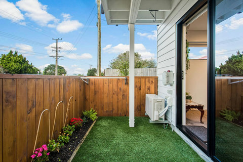 Open the ranch slider and step out into this petite backyard.