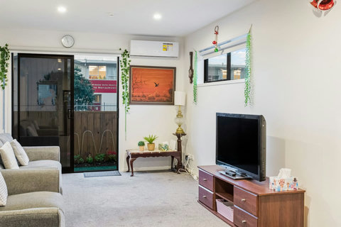 Open the ranch slider to access a small fenced garden area.