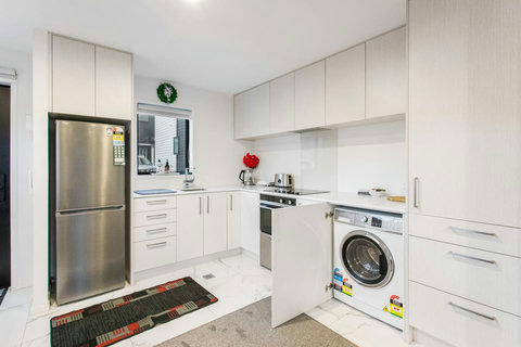 The combo washer/dryer is located in the kitchen area.
