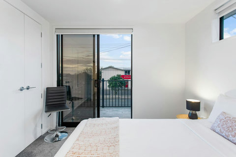 The bedroom opens onto a Juliette balcony.