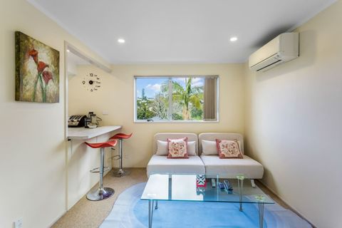 The open-plan living area features two single, pull-out sofa beds.