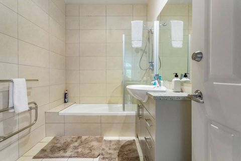 The main bathroom features a shower that also doubles as a bathtub.