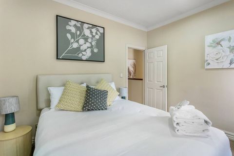 The second bedroom has a queen bed and a double wardrobe.