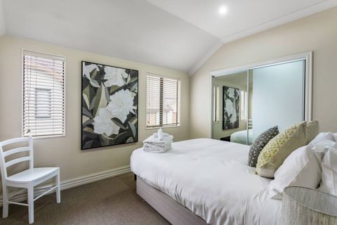 The second bedroom is tastefully appointed with modern interior design.