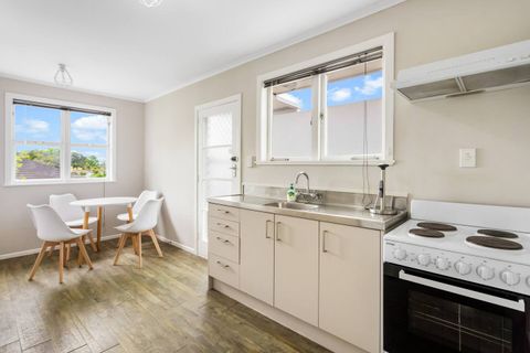 The open-plan living area features a fully equipped kitchen that opens into a small dining area.