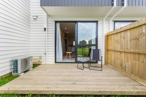 The charming backyard features a lovely patio and the perfect place for a morning coffee.