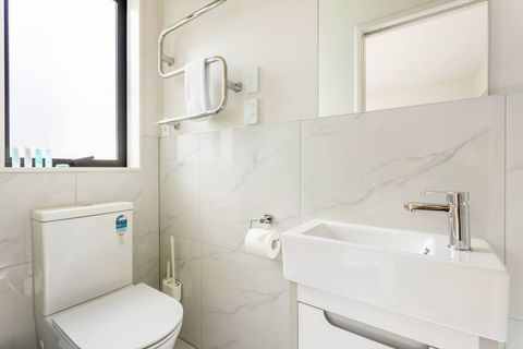 Ensuite bathroom with shower, basin and toiled is  attached to one bedroom.