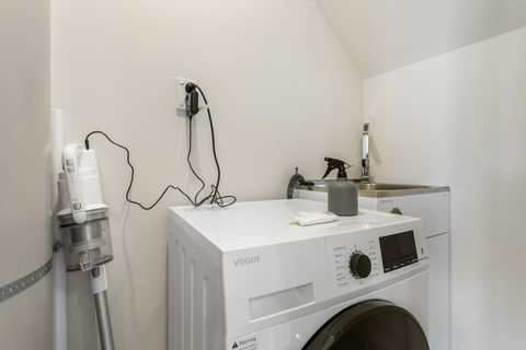 The house has a laundry with a dryer and washer combo.