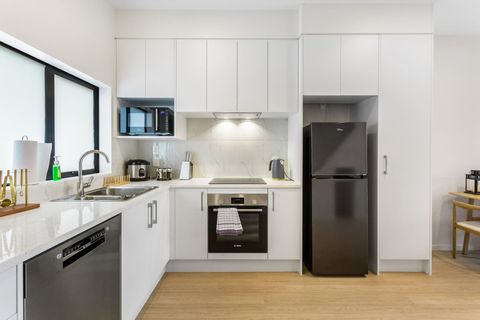 The kitchen features quality Bosch appliances including fridge, dishwasher, cook top and oven.