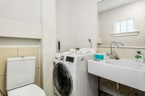 Conveniently located in the bathroom, the washer/dryer combo makes short work of the laundry.