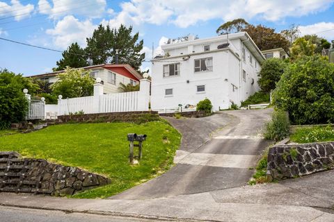 The house is set back off the road with secure off-street parking.