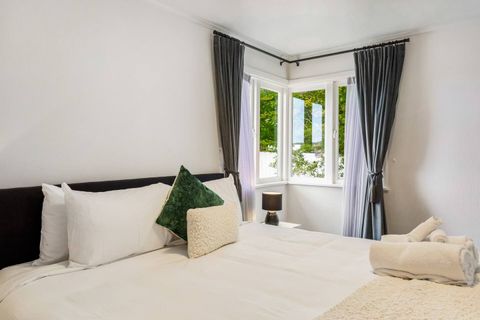 Neutral tones for this bedroom invite a great night's sleep.