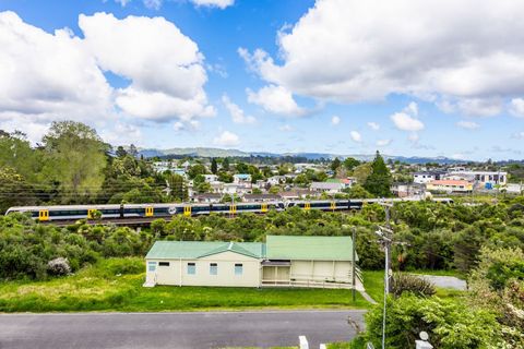 The train runs past the house, with the nearby station just a short distance away.