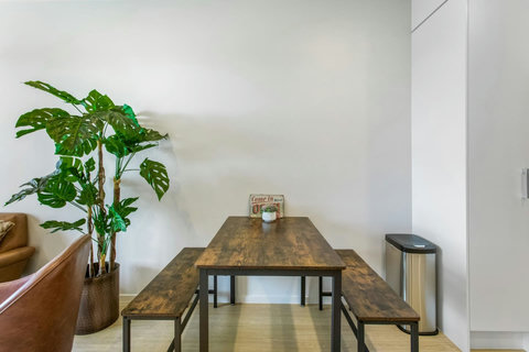 Wooden table & bench seating provides a warmth to the space. Plenty of seating for the whole house.