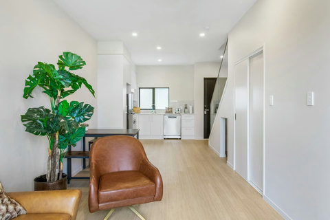 View from living area to kitchen, lovely light space to be in.