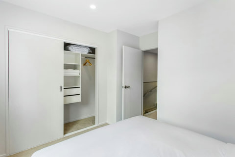 Built in storage in the wardrobe offering options for hanging clothes or storage in drawers.