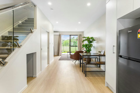 Flow from the kitchen to dining room to living room to outdoor deck area.