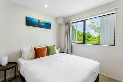 Queen sized bedroom with double wardrobe and natural light.