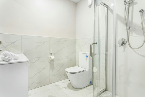 Lovely tiled shower with clean lines.