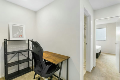 Study nook with bookshelf, great for study or work.