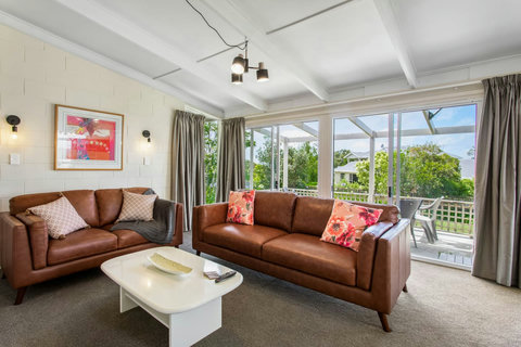 Sliding doors that open to outside deck area allowing the fresh air to blow through.