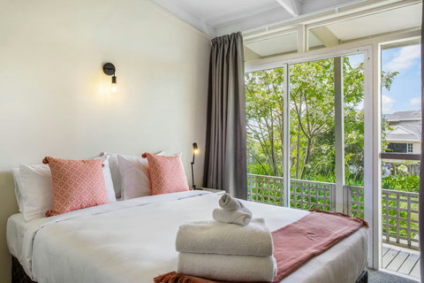 Inviting pillows and linen makes you want to snuggle in bed.