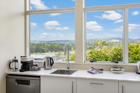 Do the dishes and enjoy this great view looking over the farmlands towards the estuary.