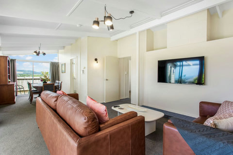 Comfortable furniture provides a place to relax and lounge whilst watching your favourite show.