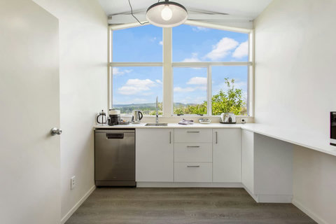 Gallery style kitchenette makes good use of the space.