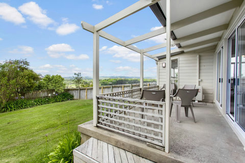 Deck off the living room with outdoor seating.