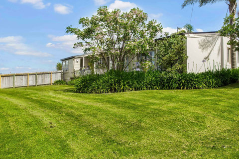 Plenty of space for the children to play on this great back lawn area.
