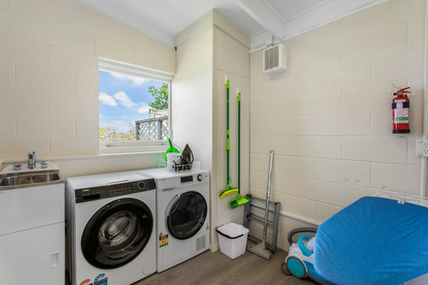 Washing machine and dryer in this laundry area helps the family washing keep up to date.