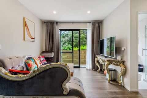 This lounge opens onto the deck area or you can pull the drapes to have a dark space.