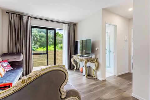 This living space has a large screen TV and access to one of the main bathrooms.