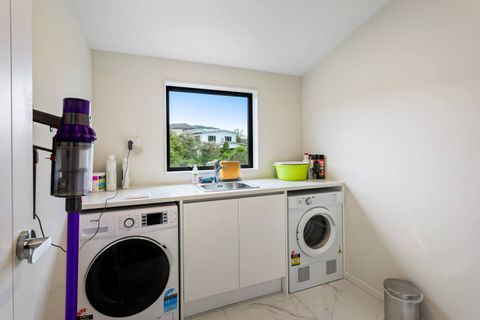 Separate laundry with washer and dryer. Plenty of space to do your washing, plus cleaning products and vacuum.