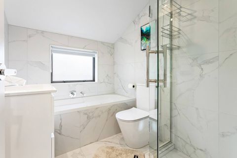 One of the main bathrooms, complete with bath and shower.