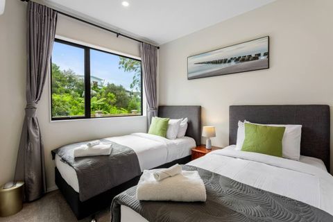 The bright green against the grey sets the tone for this bedroom.