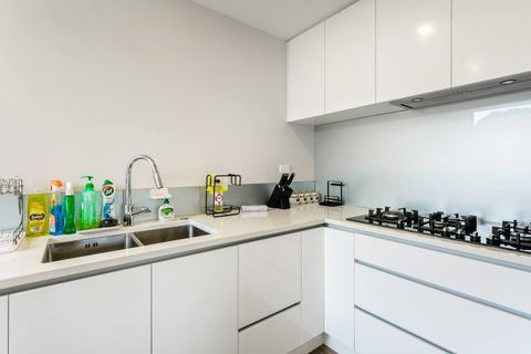 Second kitchen has a double sink, gas burners and plenty of storage.