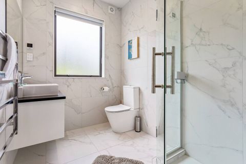 Bathroom by the second living area and single bedrooms. Has a full sized shower, toilet and basin.