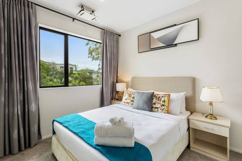 Lovely neutral tones with heavy drapes allows for a restful place to relax, read a book or sleep.