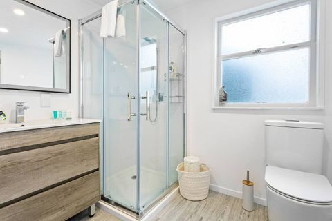 Tucked behind the kitchen, the bathroom area has been renovated to a modern standard.